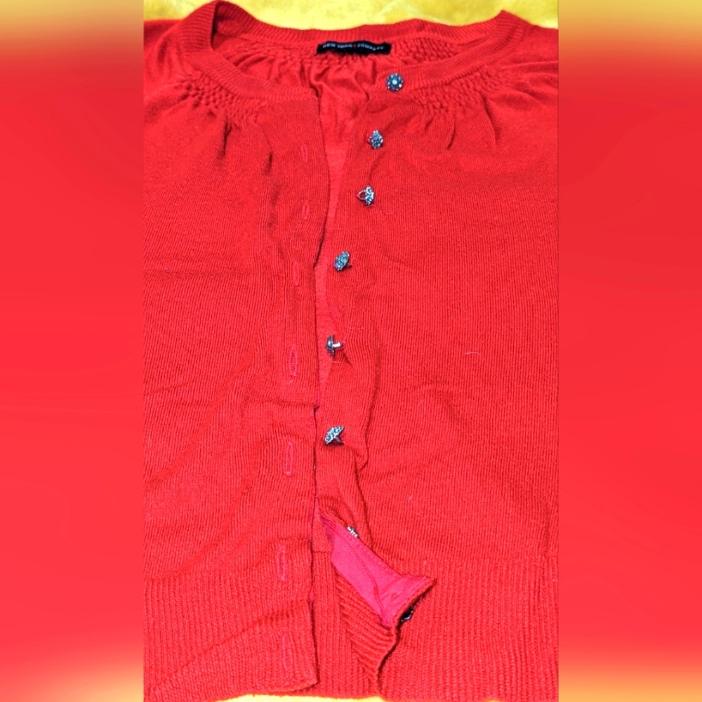 Cardigan New York and a company with shiny buttons
